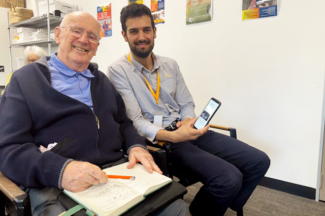 Senior learning about cybersecurity in a seniors tech class Brisbane