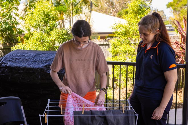 NDIS Brisbane assistance with daily life showing laundry help