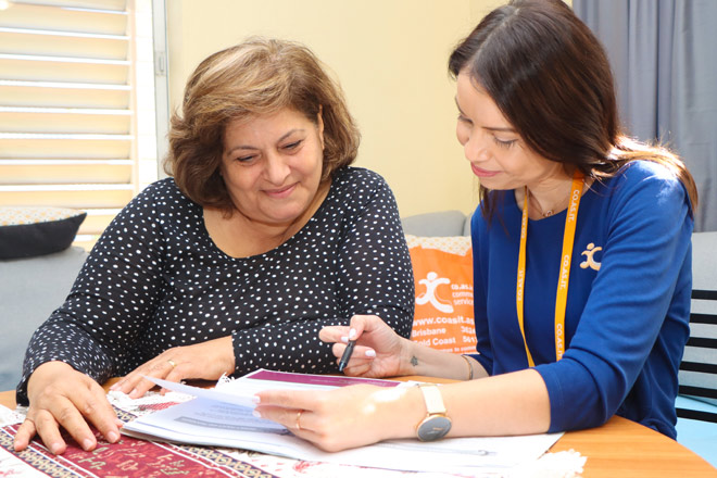 QCSS discussing care with a lady