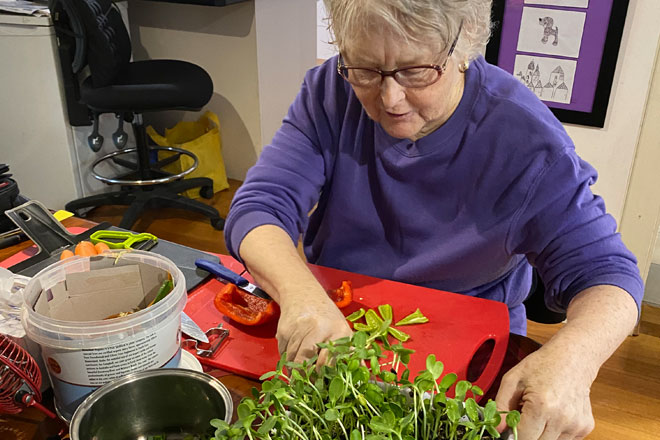 Woman preparing meal and getting help to prepare meals at home CHSP Brisbane